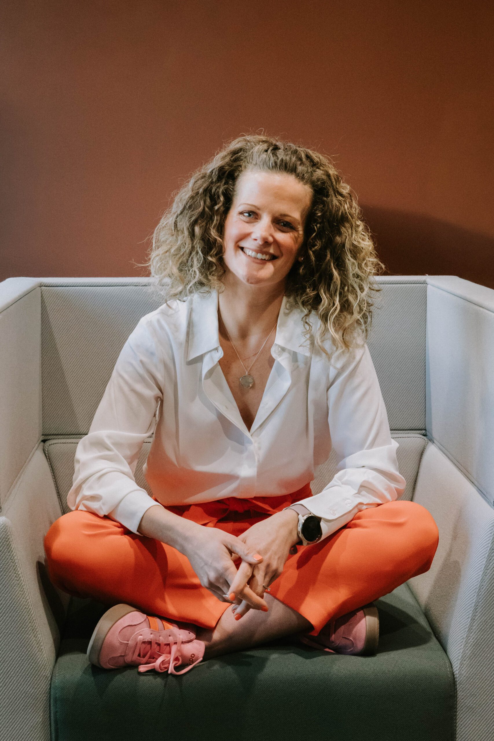 Lady stood next to cold water tank in branded robe